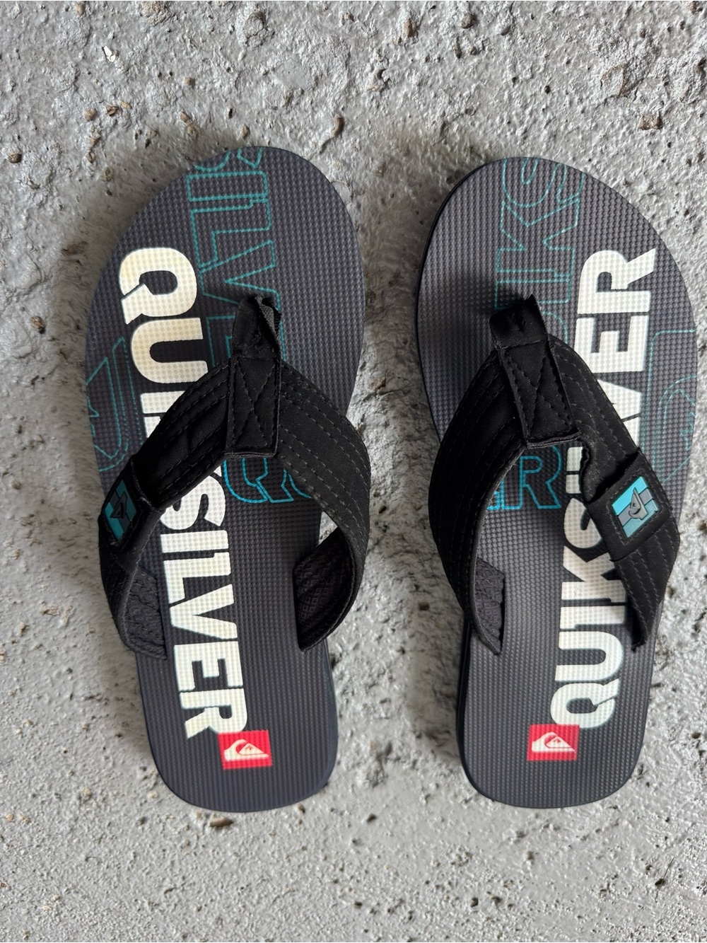 Quiksilver Men’s Black Flip Flops with Teal Logo Accents